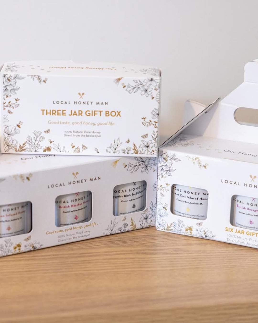 Gift set featuring raw honey, bee pollen, and honey dipper, perfect for buying pure honey for sale this holiday season.